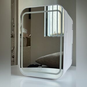 SKINCARE FRIDGE WITH AN LED-lighted mirror door.